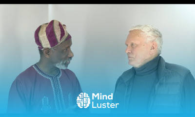 Dr Imran Alawiye in conversation with one his old friends and students