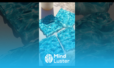 Resin water ripple coaster depicts a vivid aqua blue surface in sunlight resinart coaster