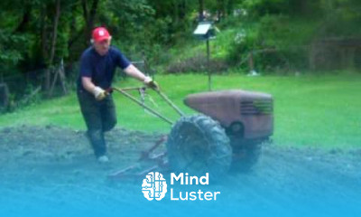 David Bradley Tractor at work With 4 Attachments